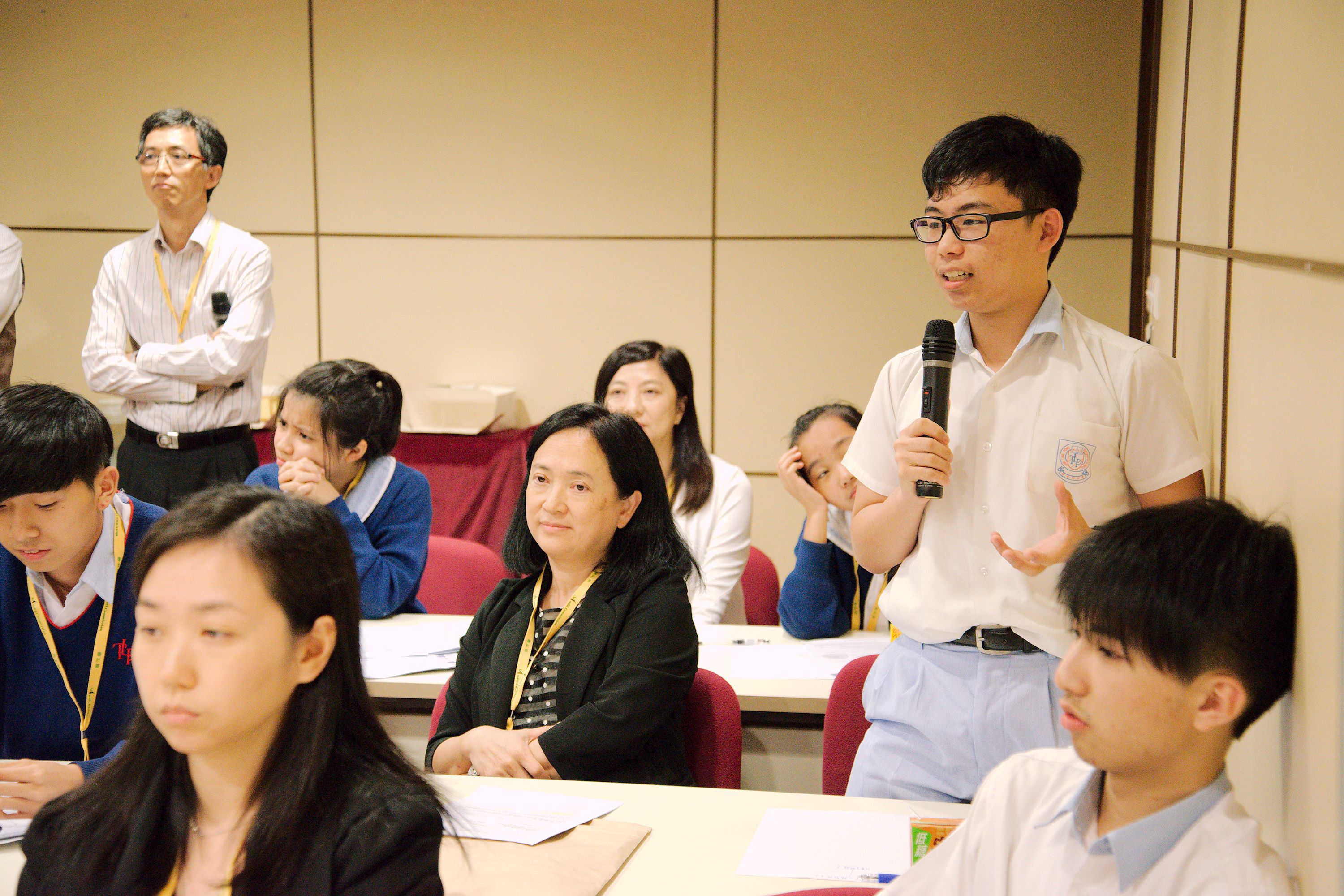 A student sharing his fruitful experience at debriefing and closing session